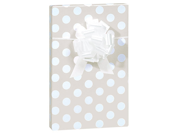 Beige and white polka dot wrapped gift with white box on top with white background.